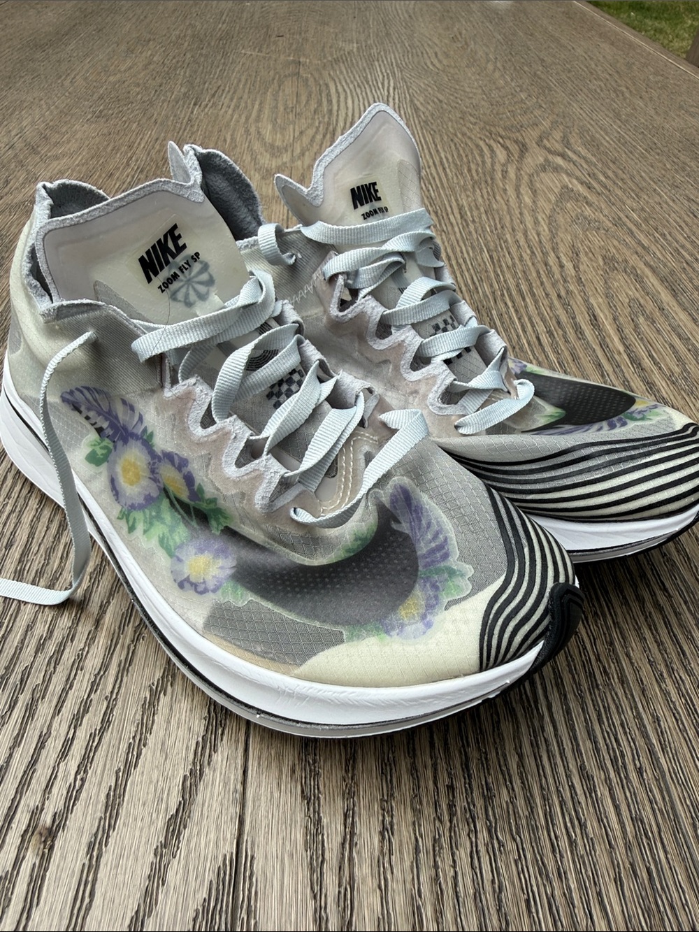 Nike Women's Gray Athletic Sneakers with Purple Floral Accents
